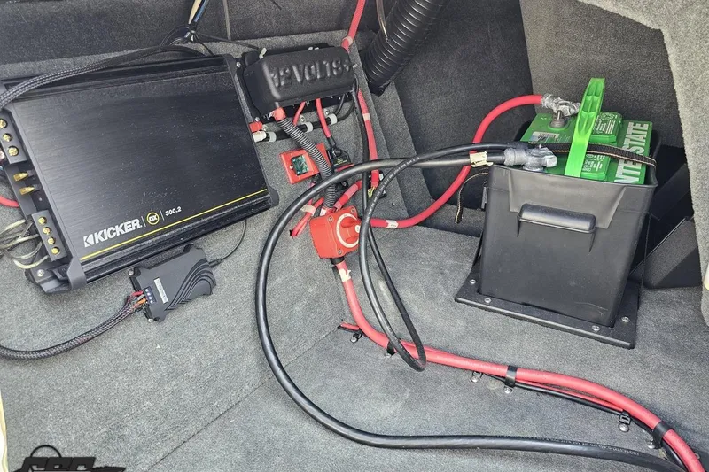 Slide: The Image of 2014 Moomba Outback V audio system with Kicker amplifier and battery setup. - 55