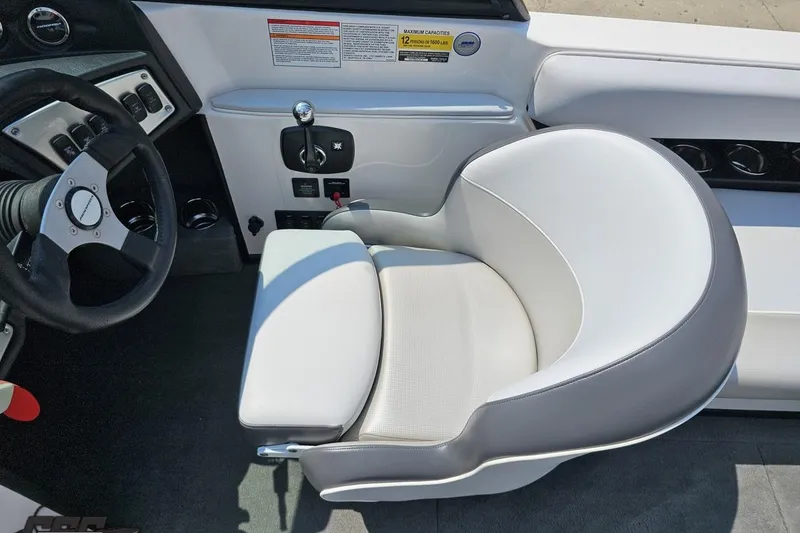 Slide: The Image of 2014 Moomba Outback V boat interior with steering wheel and control panel. - 56