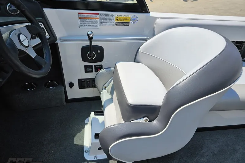 Slide: The Image of 2014 Moomba Outback V boat interior with steering wheel and captain's seat. - 57