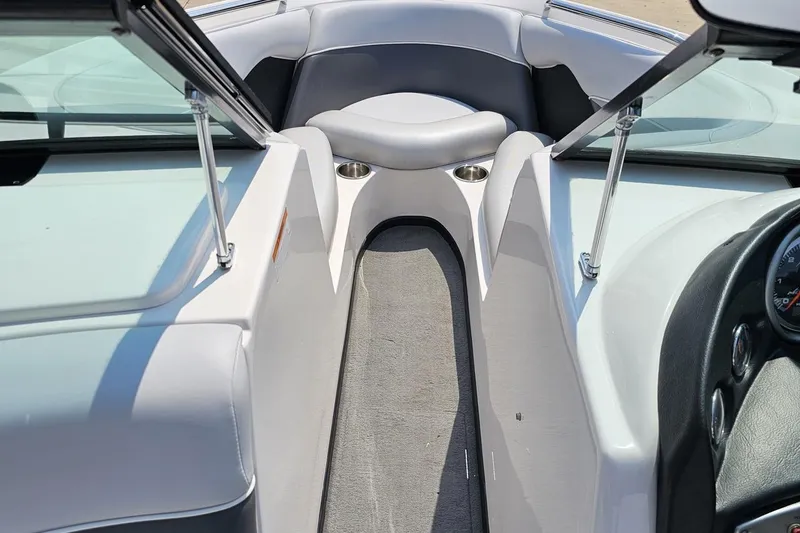 Slide: The Image of 2014 Moomba Outback V boat interior with open bow seating and cup holders. - 63