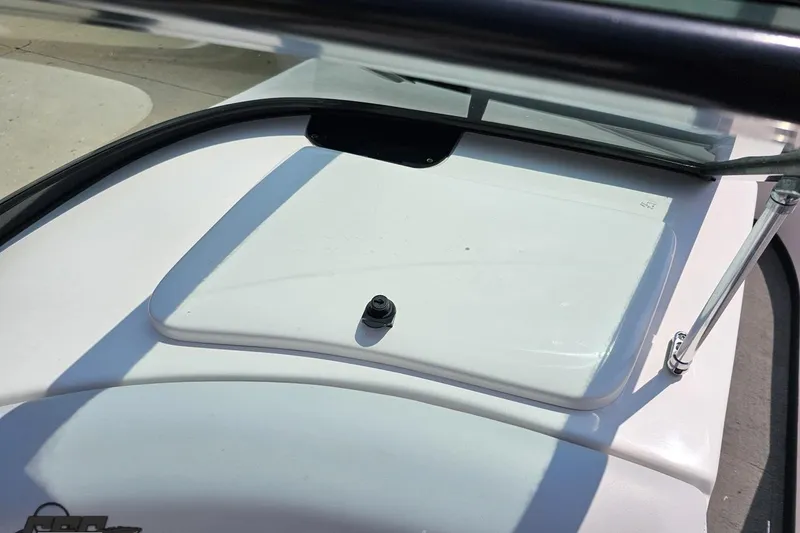 Slide: The Image of 2014 Moomba Outback V boat dashboard with windshield and hatch detail. - 64