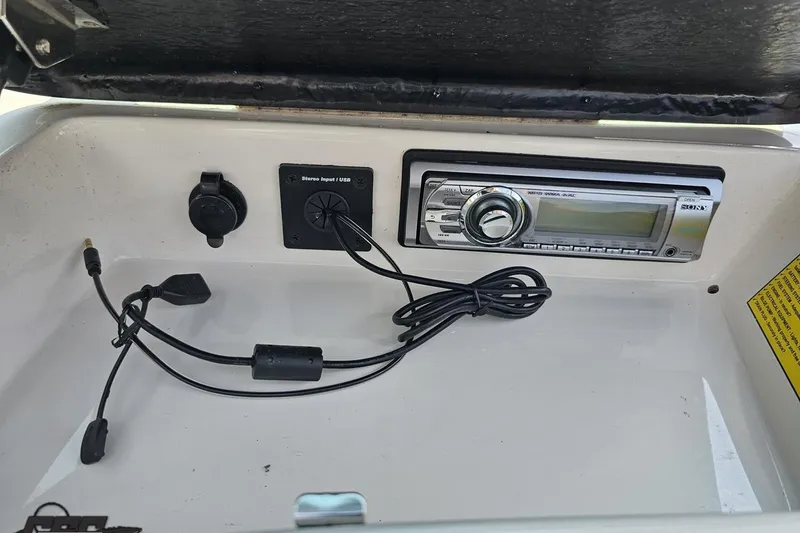 Slide: The Image of 2014 Moomba Outback V stereo system with USB and auxiliary input. - 65