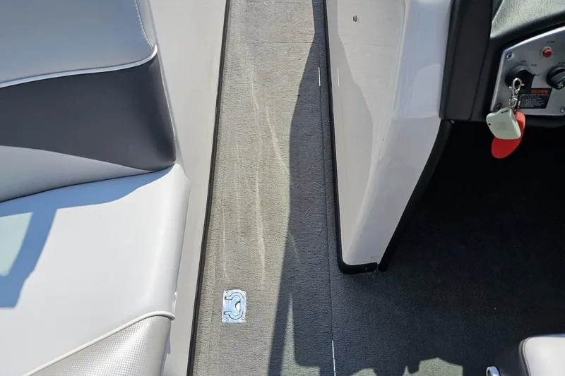 Slide: The Image of Interior view of a 2014 Moomba Outback V boat, showing seating and control panel. - 66