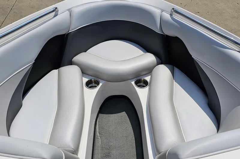 Slide: The Image of 2014 Moomba Outback V boat interior with gray seating and cup holders. - 68