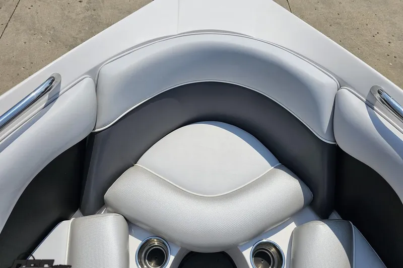 Slide: The Image of 2014 Moomba Outback V boat interior with white cushioned seating and cup holders. - 73