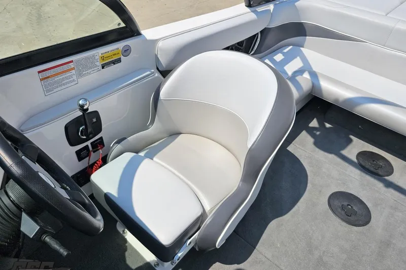 Slide: The Image of 2014 Moomba Outback V boat interior with steering wheel and seating. - 78