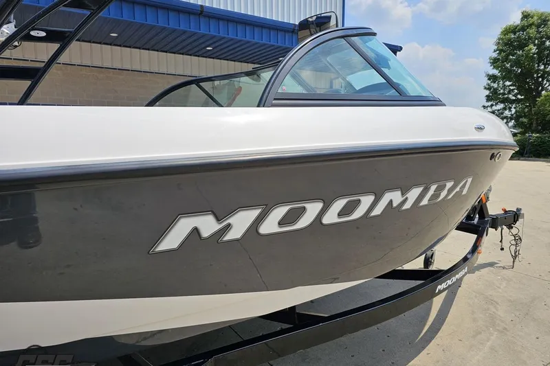 Slide: The Image of 2014 Moomba Outback V boat on trailer, parked outdoors. - 8