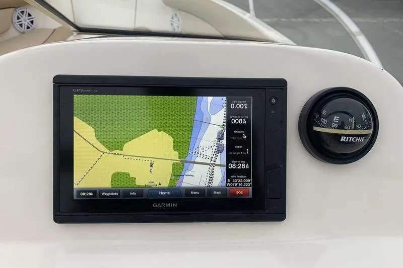 Slide: The Image of Garmin GPS and compass on 2018 Scout 225 Dorado boat dashboard. - 18