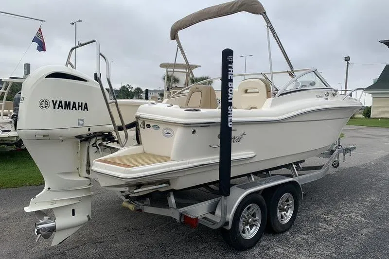 Slide: The Image of 2018 Scout 225 Dorado boat on trailer with Yamaha outboard motor. - 4