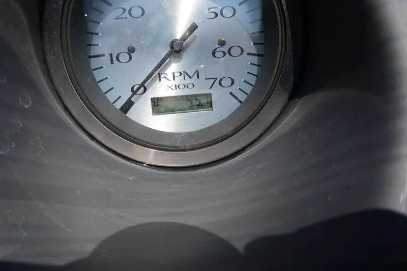 Slide: The Image of Close-up of a 2022 Bennington 20 SLM RPM gauge displaying engine speed. - 12
