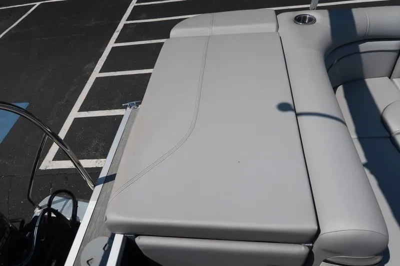 Slide: The Image of 2022 Bennington 20 SLM boat seating area with sleek gray upholstery. - 16