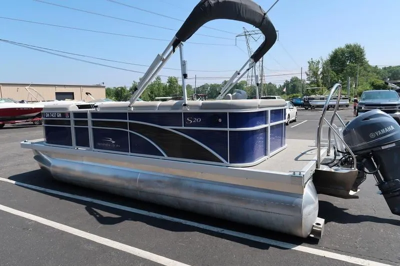 Slide: The Image of 2022 Bennington 20 SLM pontoon boat with Yamaha motor in parking lot. - 3