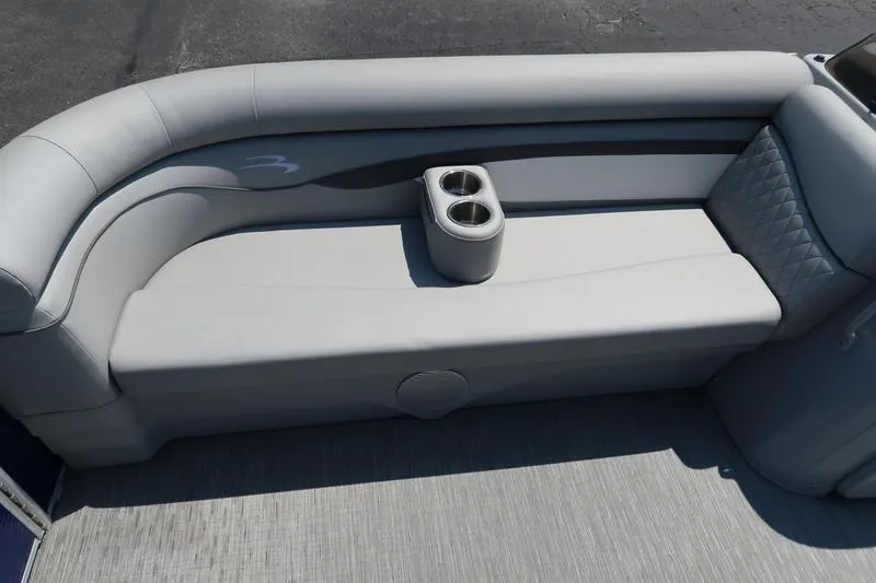 Slide: The Image of 2022 Bennington 20 SLM boat interior with gray seating and cup holders. - 4