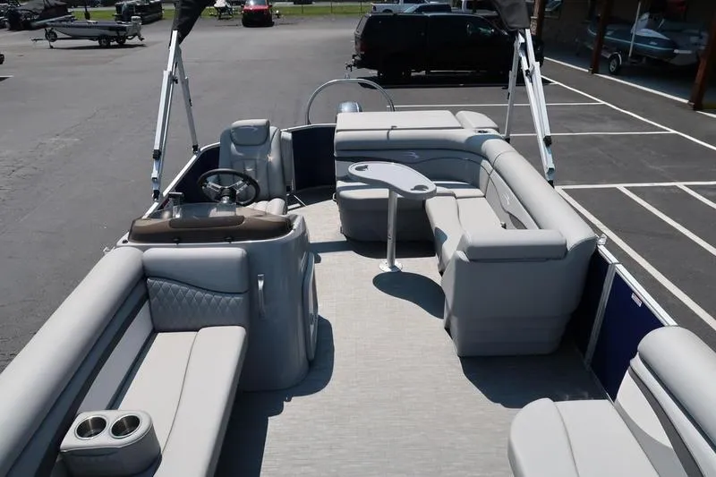 Slide: The Image of 2022 Bennington 20 SLM pontoon boat with spacious seating and modern design. - 5