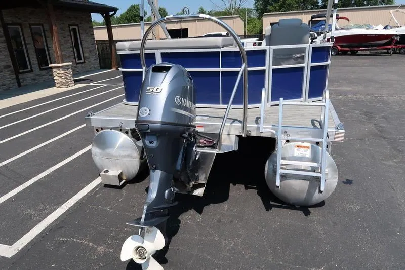 Slide: The Image of 2022 Bennington 20 SLM pontoon boat with Yamaha 50 outboard motor in parking lot. - 6