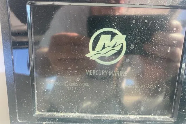 Slide: The Image of Display screen of a 2016 Boston Whaler 315 Conquest showing Mercury Marine engine hours. - 6