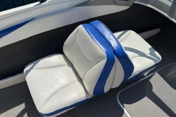Slide: The Image of 2006 Bayliner 185 Bowrider interior seating with blue and white upholstery. - 14