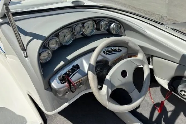 Slide: The Image of 2006 Bayliner 185 Bowrider dashboard with steering wheel and instrument panel. - 16