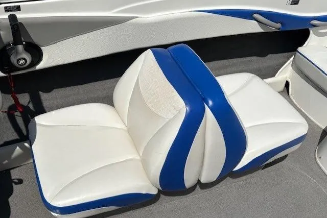 Slide: The Image of 2006 Bayliner 185 Bowrider interior with white and blue seating. - 19