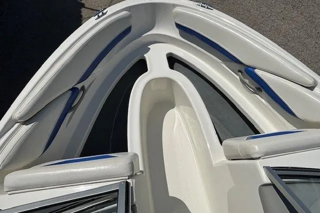 Slide: The Image of 2006 Bayliner 185 Bowrider boat interior with white and blue seating. - 9
