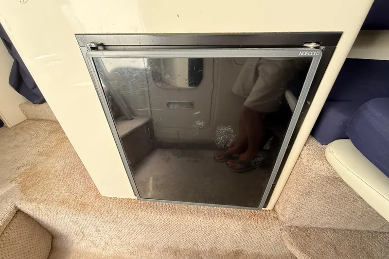Slide: The Image of Norcold refrigerator in 2000 Rinker 270 Fiesta Vee boat interior. - 26