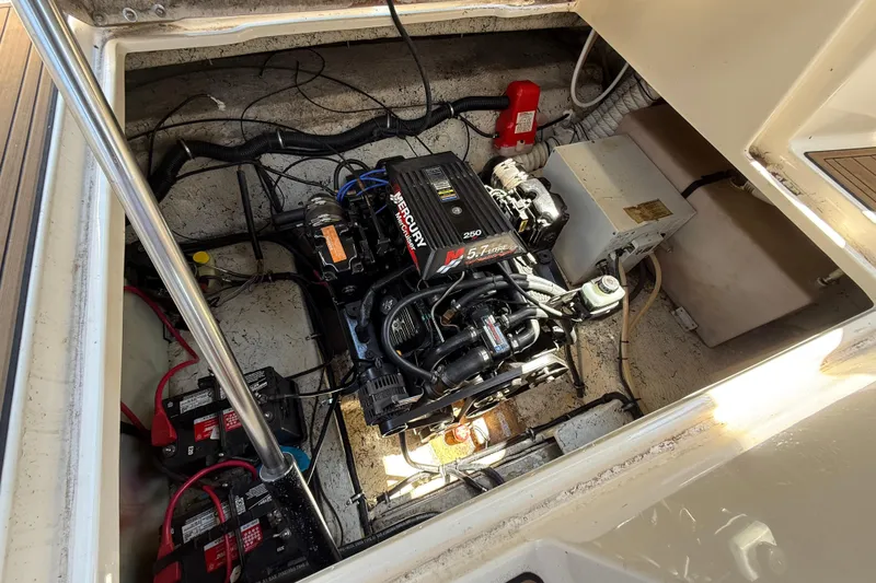 Slide: The Image of Engine compartment of a 2000 Rinker 270 Fiesta Vee boat with Mercury engine. - 28