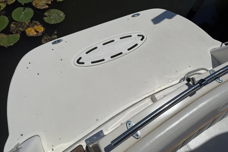 Slide: The Image of Rear deck of 2000 Rinker 270 Fiesta Vee boat with lily pads nearby. - 29