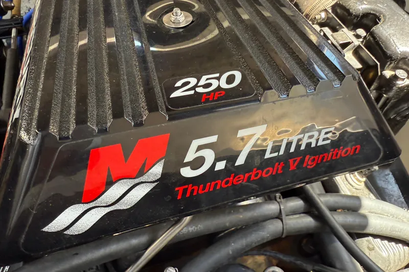 Slide: The Image of Engine cover of a 2000 Rinker 270 Fiesta Vee, 5.7L, 250 HP, Thunderbolt V Ignition. - 30