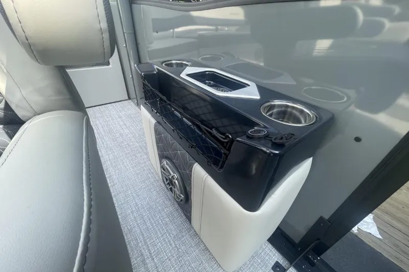 Slide: The Image of 2026 Harris Grand Mariner 250 interior with cup holders and speaker system. - 10