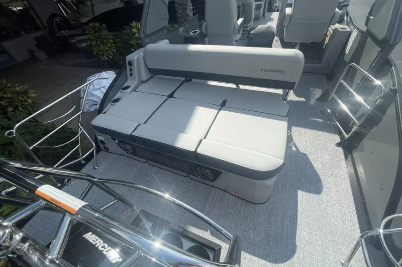 Slide: The Image of 2026 Harris Grand Mariner 250 boat interior with cushioned seating and sleek design. - 11