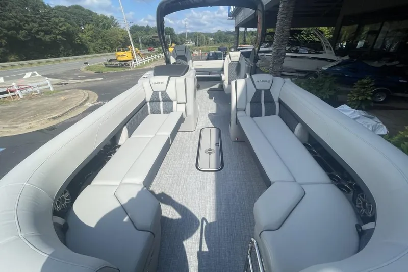 Slide: The Image of 2026 Harris Grand Mariner 250 pontoon boat interior with luxurious seating and modern design. - 14