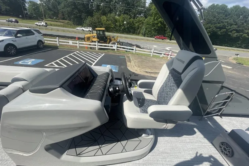 Slide: The Image of Captain's seat of 2026 Harris Grand Mariner 250 boat, featuring modern design and controls. - 5