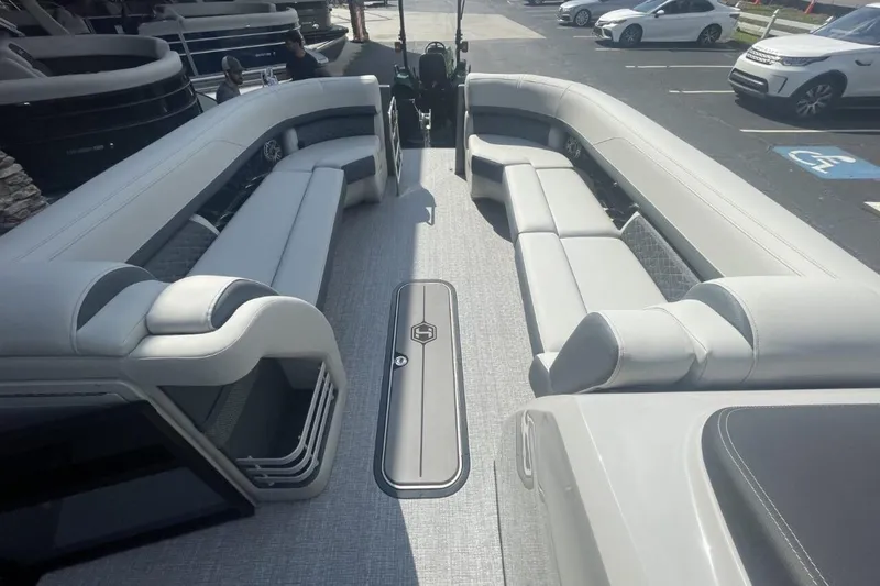 Slide: The Image of 2026 Harris Grand Mariner 250 pontoon boat interior with spacious seating and modern design. - 7