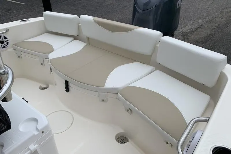 Slide: The Image of 2025 Bulls Bay 200CC boat interior with beige and white cushioned seating. - 10