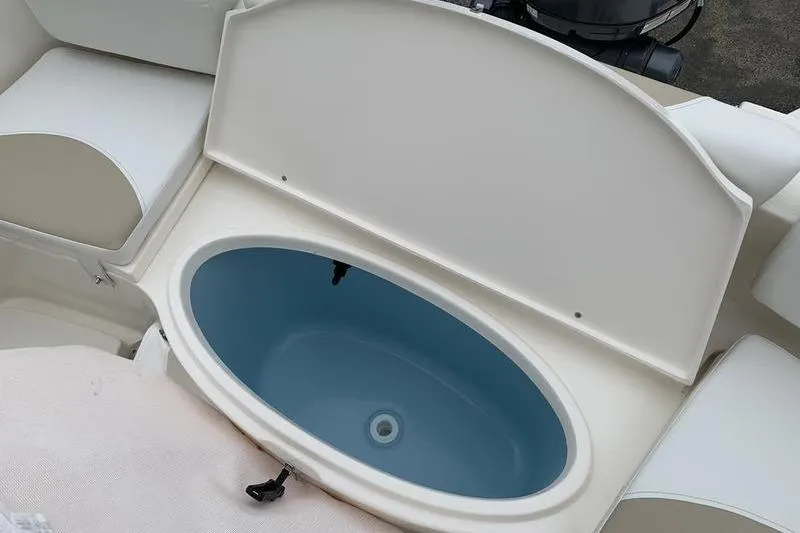 Slide: The Image of 2025 Bulls Bay 200CC boat livewell with open lid, showcasing interior design. - 11