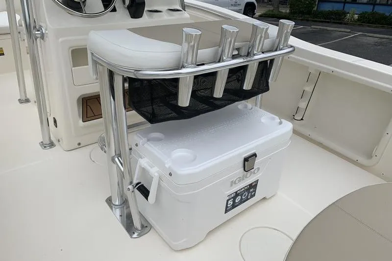Slide: The Image of 2025 Bulls Bay 200CC boat interior with cooler and rod holders. - 12
