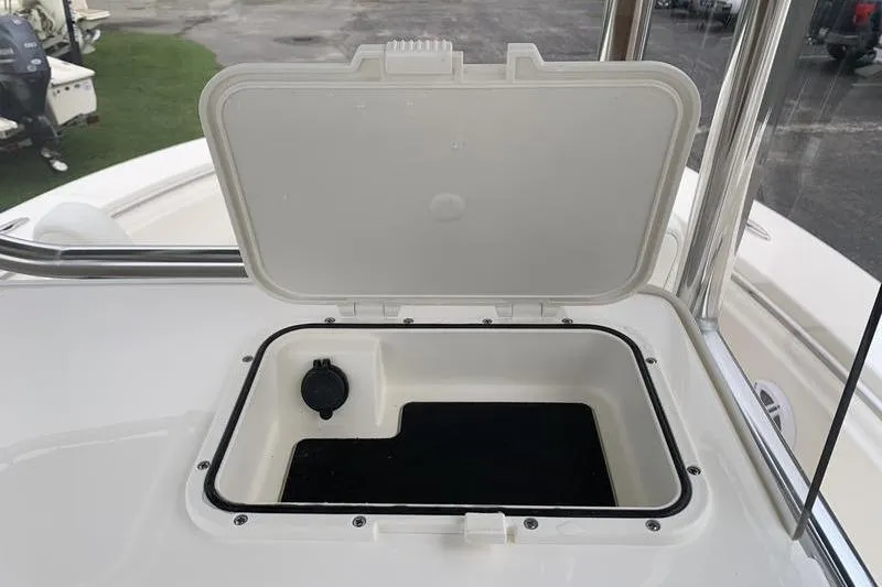 Slide: The Image of 2025 Bulls Bay 200CC boat storage compartment with open lid, showcasing interior space. - 21