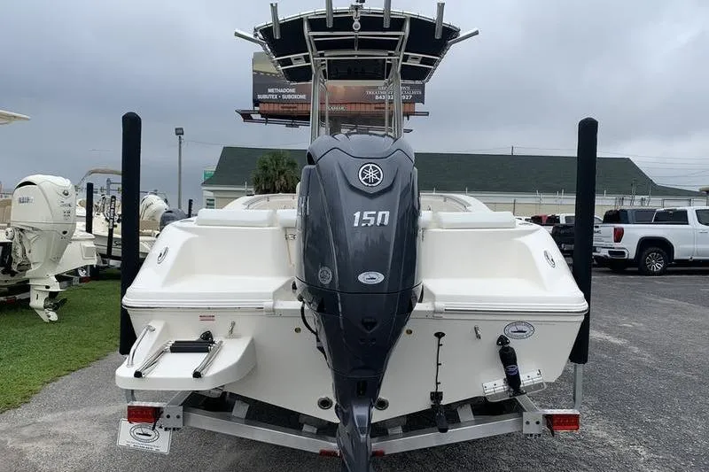 Slide: The Image of 2025 Bulls Bay 200CC boat with Yamaha 150 outboard motor, parked on a trailer. - 3