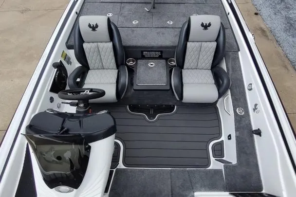 Slide: The Image of 2026 Phoenix 819ZXL boat interior with dual seats, steering console, and storage compartments. - 5