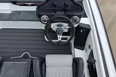 Slide: The Image of 2026 Phoenix 819ZXL boat interior with steering wheel and seating, featuring modern design elements. - 8