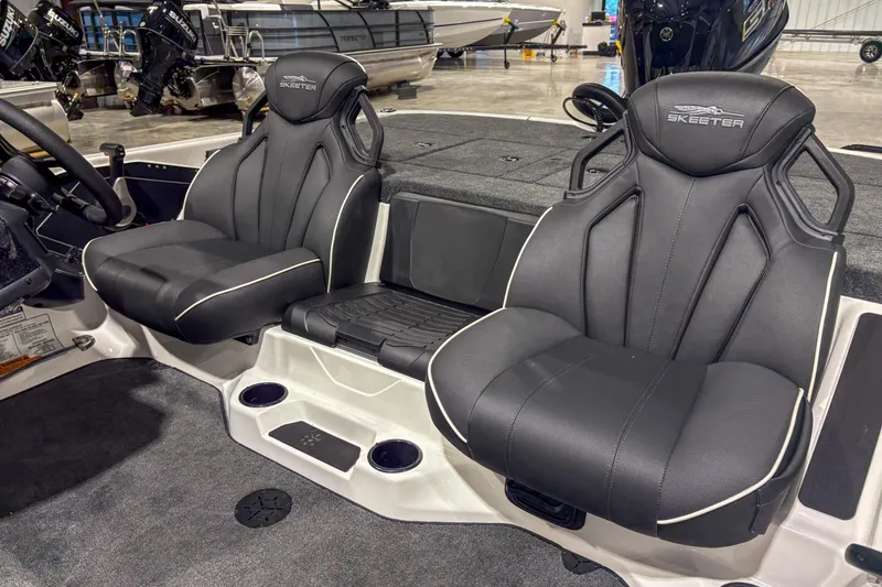 Slide: The Image of 2026 Skeeter ZXR 19 boat interior with black cushioned seats and sleek design. - 10