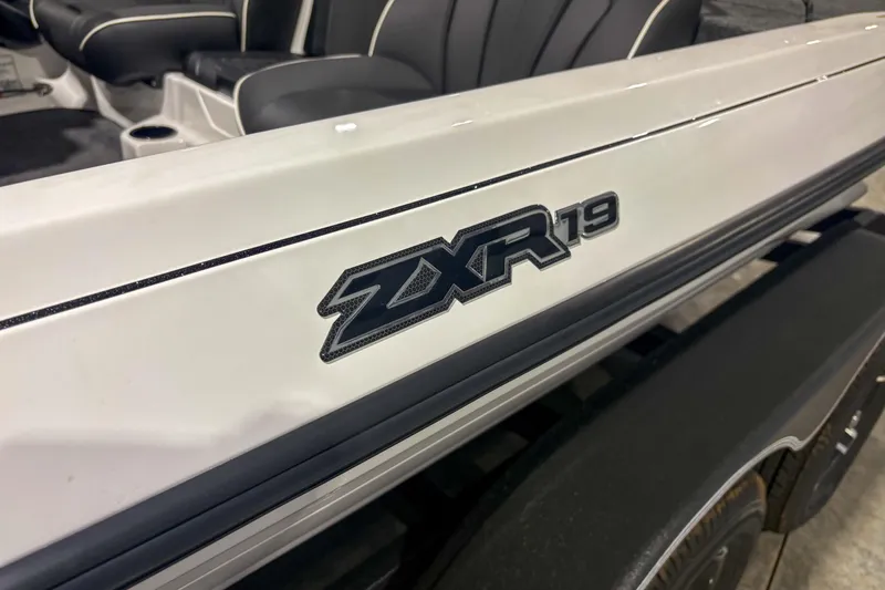Slide: The Image of 2026 Skeeter ZXR 19 boat, close-up of logo and seating area. - 11