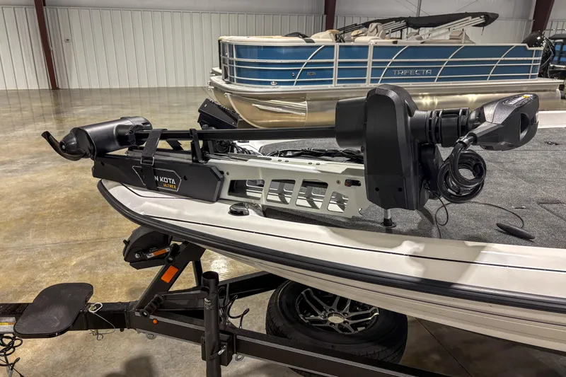Slide: The Image of 2026 Skeeter ZXR 19 boat with Minn Kota Ultrex trolling motor in a showroom. - 9