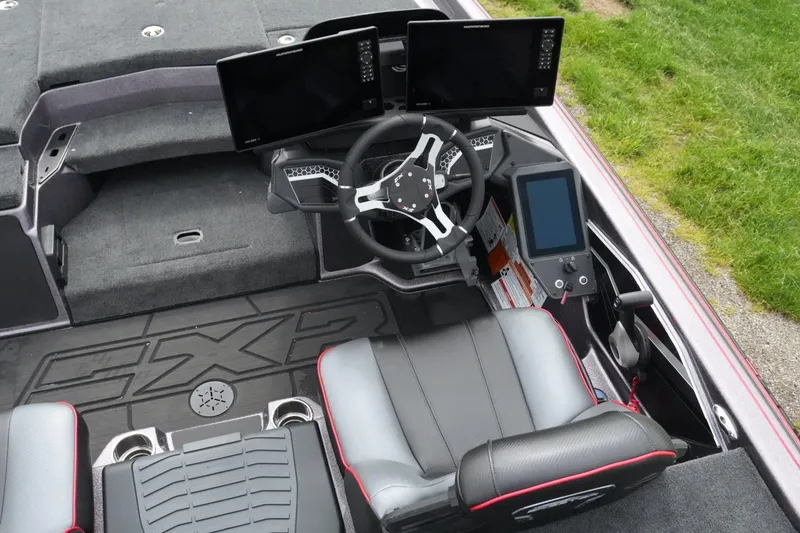 Slide: The Image of 2025 Skeeter FXR20 LE boat cockpit with advanced navigation displays and ergonomic seating. - 11