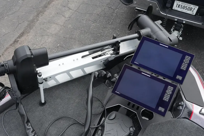 Slide: The Image of 2025 Skeeter FXR20 LE boat with dual fishfinder displays and trolling motor. - 14