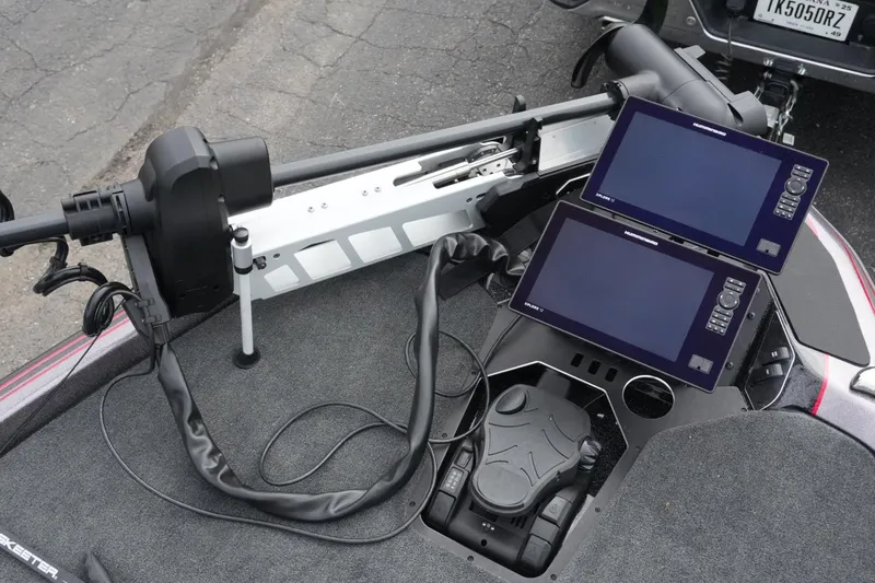 Slide: The Image of 2025 Skeeter FXR20 LE boat dashboard with dual electronic displays and trolling motor. - 15