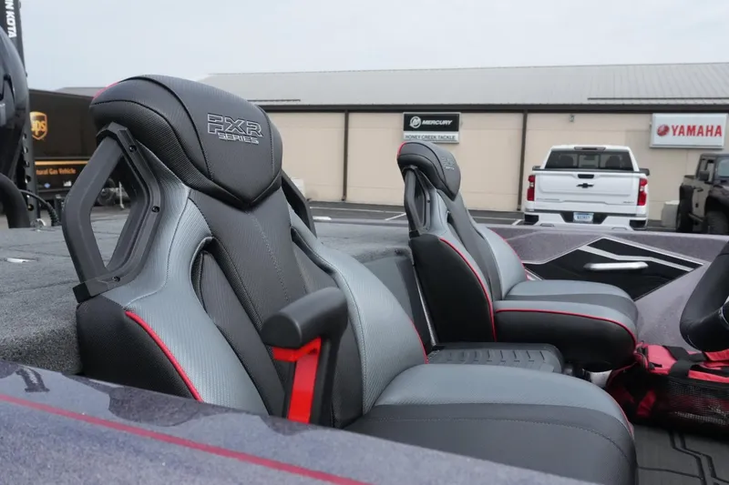 Slide: The Image of 2025 Skeeter FXR20 LE boat seats with sleek design and red accents. - 8