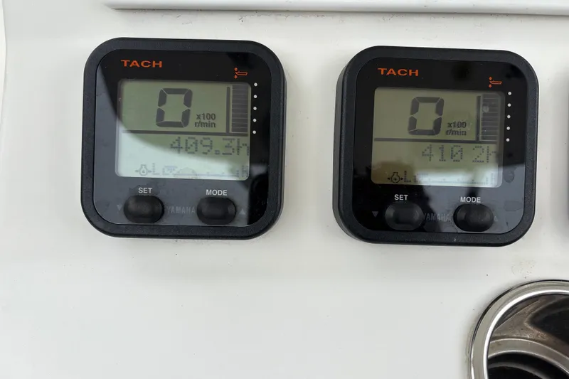 Slide: The Image of Digital tachometers on a 2008 Regulator 26 Forward Seating boat dashboard. - 12