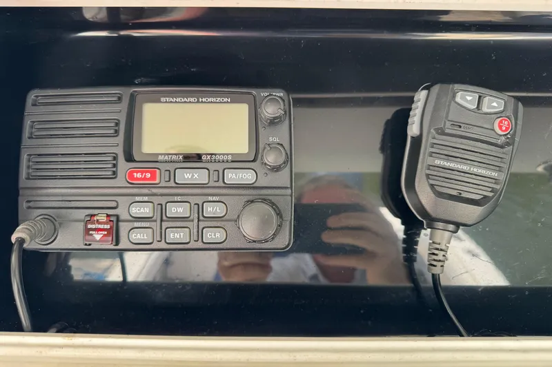 Slide: The Image of VHF radio system on 2008 Regulator 26 Forward Seating boat dashboard. - 9