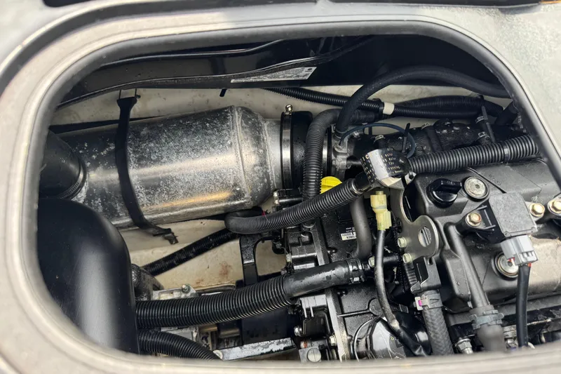 Slide: The Image of 2020 Yamaha WaveRunner EX Deluxe engine compartment with visible components and wiring. - 10